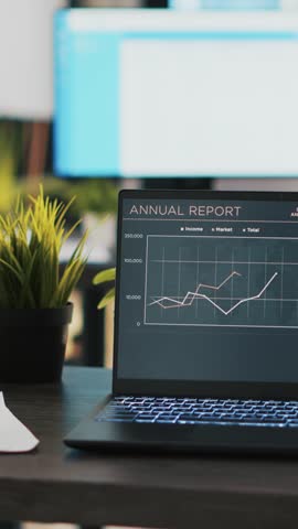 Vertical video Business graphs and figures on laptop monitor showing upward trend and profit concept. Economic annual report charts on notebook screen in company financial department office panning
