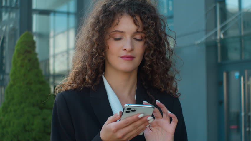 Caucasian businesswoman young girl using smartphone in city think idea dream female employer office manager browsing mobile phone internet data connections business network online shopping outdoors Royalty-Free Stock Footage #3457619623