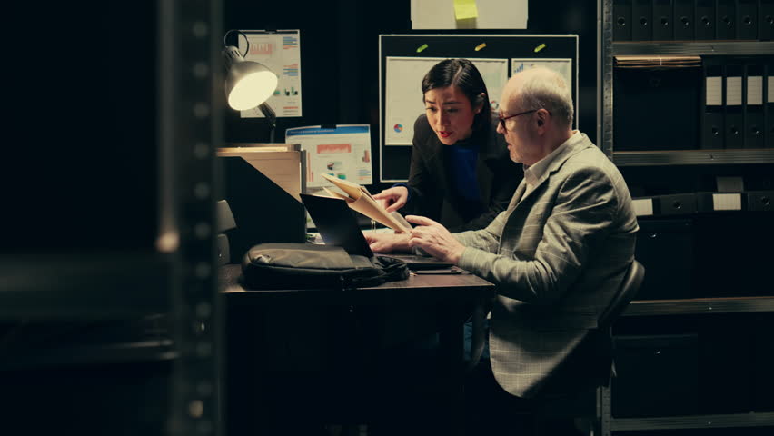 Private detectives identifying patterns in criminal behavior by analyzing archived records, working on federal case. Agents investigate authenticity of witness statements. Camera B.