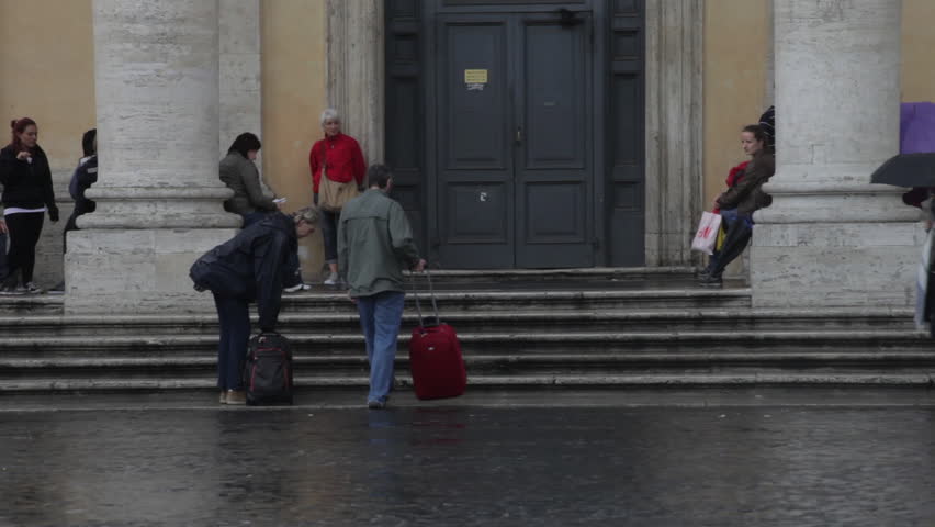 Tourists waiting for transportation by the PIazza Del Popolo