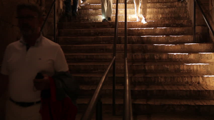 ROME - CIRCA MAY 2012: Tourists walk down stairs in the Colosseum 