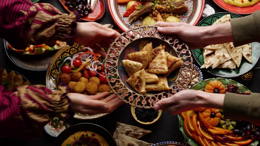 Friends and family are cooking, sharing, and enjoying traditional Eid cuisine