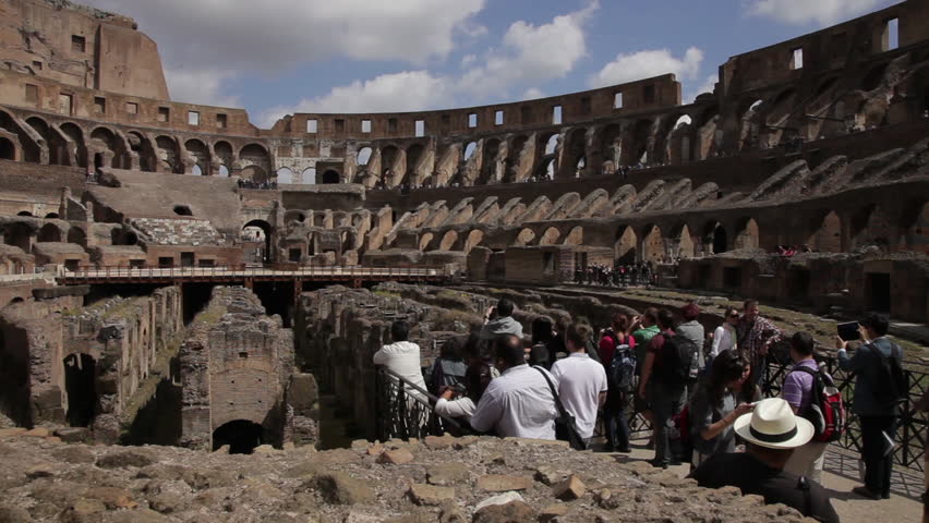 Tourists looking around inside the Colosseum