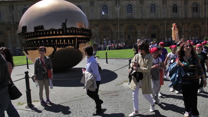 VATICAN CITY - MAY 5, 2012: A school group of children walk by the Sphere Within