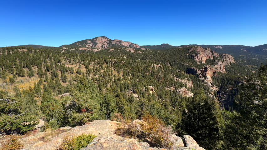 Colorado summer Chimney Rock hike bike horse ride trail Staunton State Park Rocky Mountains Pikes peak Bugling Elk Falls trail Bailey Conifer Evergreen sunny blue sky scenic landscape slow pan right