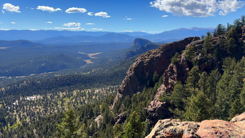 Colorado summer hike bike horse ride trail Staunton State Park Rocky Mountains Pikes peak Bugling Elk Falls trail Bailey Conifer Evergreen sunny blue sky clouds scenic landscape view slow pan left
