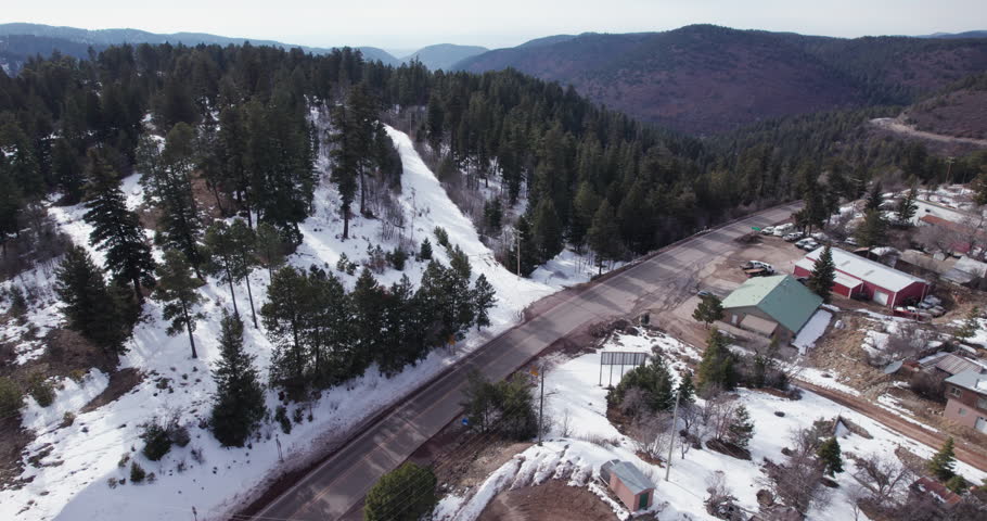 Aerial drone shot of road in to Cloudcroft, New Mexico, boom up