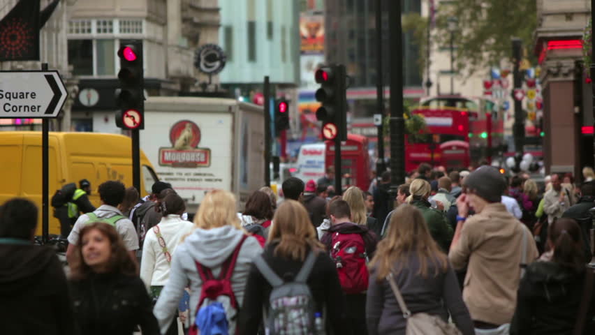LONDON - OCTOBER 7, 2011: Unidentified people walking on a busy street