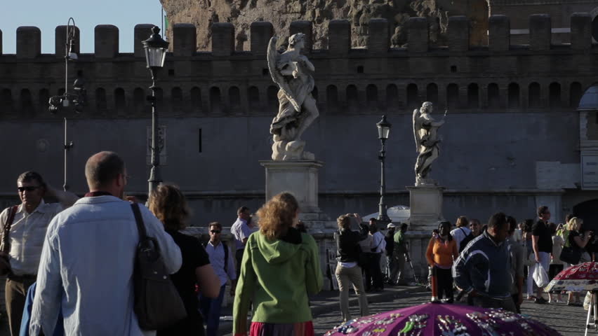 ROME - CIRCA MAY 2012: A man surveys the scene on and around the Ponte
