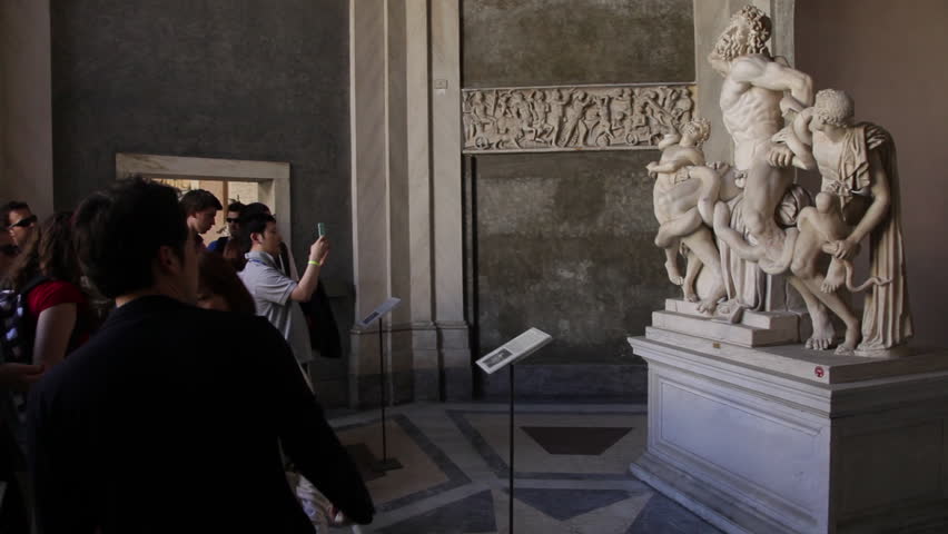 VATICAN CITY - MAY 5, 2012: Tourists take pictures of the Laocoon in the Vatican