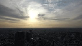 TOKYO, JAPAN : Aerial sunset view of CITYSCAPE of TOKYO and MOUNT FUJI. Buildings around Shibuya. Japanese urban city, metropolis and nature concept video. Long time lapse shot, dusk to night.