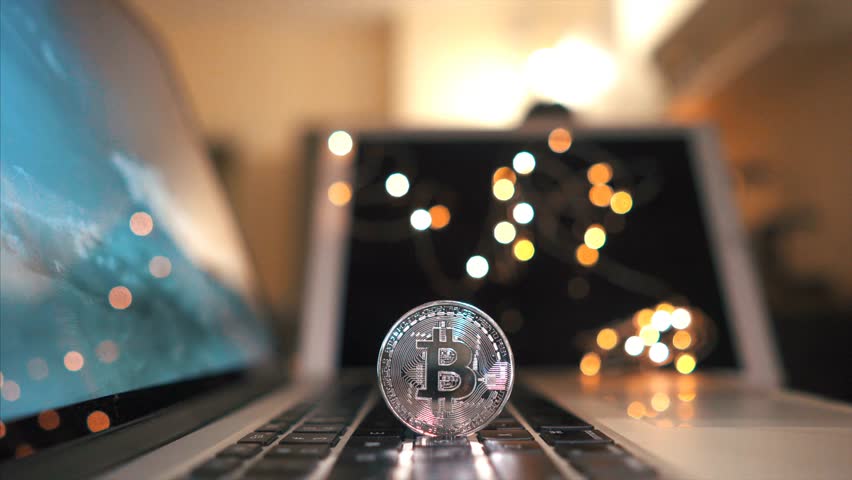 Real Bitcoin Close-Up, Cryptocurrency Authenticity , Witness the authenticity of Bitcoin with a close-up view of a real crypto coin on a keyboard, symbolizing the tangible nature of digital assets Royalty-Free Stock Footage #3457819181