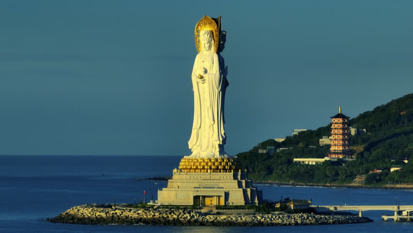 Buddhism Guanyin statue at seaside in nanshan temple, hainan island , China, words mean blessing and mercy