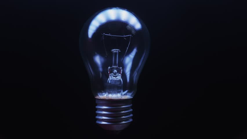 An electric tungsten lamp turns on and off at different intervals Royalty-Free Stock Footage #3457904699
