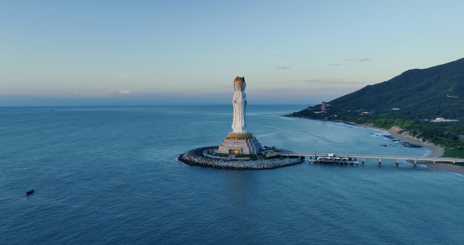 Buddhism Guanyin statue at seaside in nanshan temple, hainan island , China, words mean blessing and mercy
