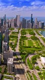 Stunning panoramic view of amazing Chicago, Illinois. Drone footage rising over the metropolis downtown. Sunny day view. Vertical video.