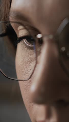 Macro shot of woman eye reflecting monitor screen. Human eye reads information from screen, book, laptop, computer, phone Royalty-Free Stock Footage #3457940559