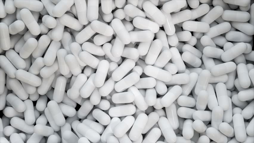 Manufacturing of medications and pharmaceuticals, numerous capsules. Close-up of medicinal tablets spinning. Medications substances. The pharmaceutical sector. Concept of healthcare. 3D Illustration