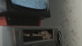 Old TV with video cassette in the interior