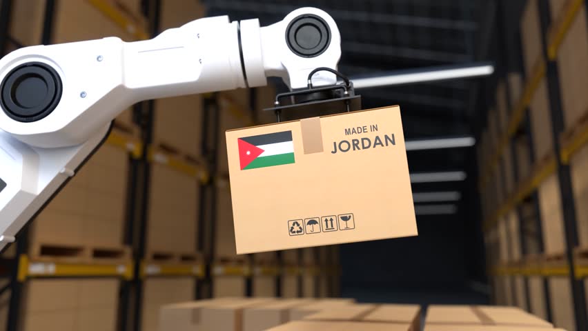 The robot arm is lifting a box of products made in Jordan, The Warehouse automation concept