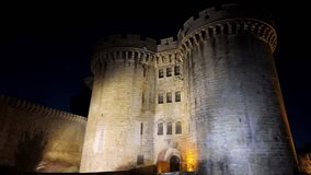 Alencon Ducal Castle illuminated at night, Orne in Normandie, France. Low angle backward