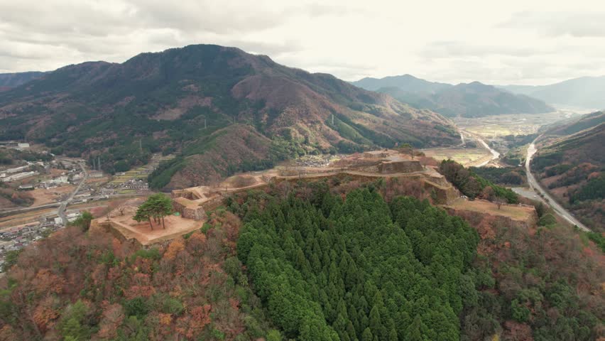 Japanese Mountain Range Valley Aerial Drone Landscape Drone Flying Above Outskirts of Kyoto in Takeda Castle Ancient ruins, hyogo asago