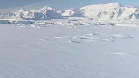 Snow Covered Antarctic Surface Timelapse Aerial View Flight. South Pole Ice Landscape. Winter Frozen Ground Continent Snowy Frost Rock Epic Drone Fly Footage Shot in 4K (UHD) - Powered by Shutterstock - Get 15% off with code: PIKWIZARD15