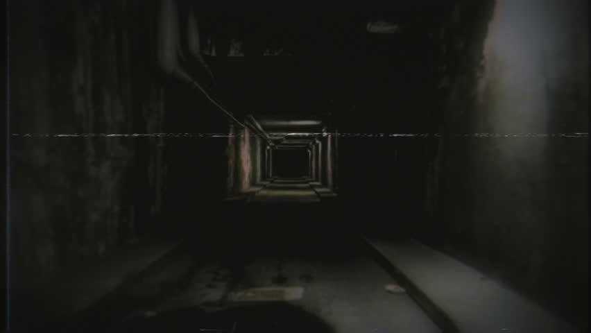 Walking Through Scary Tunnel Spooky Scene Old VHS Effect Tracking Shot. Camera going inside an empty spooky street tunnel, vintage VHS effect. Tracking shot