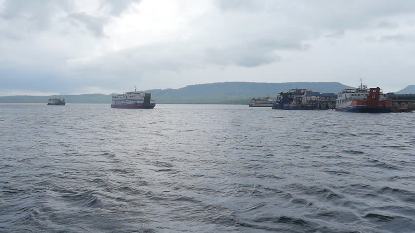 ferrys sails across the ocean between the islands.