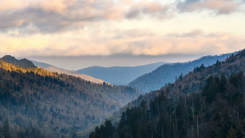 Clouds moving over mountains at sunrise in the early morning of Great Smoky Mountains National Park Royalty-Free Stock Footage #3458312579