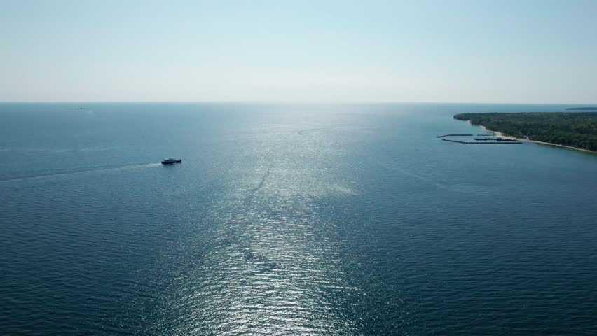Drone shot of a ferry carrying cars and people in door county, Wisconsin