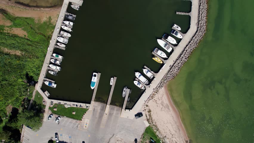 Drone aerial view looking straight down at a marina full of boats in lake Michigan