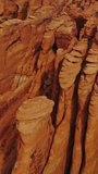 Geological formation in the Arches national Park in Utah, USA. Amazing bare rounded rocks in the shape of plates piled together. Top view. Vertical video.