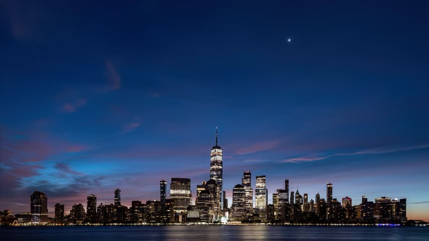 Night to day time lapse of alpenglow over Lower Manhattan in early morning Royalty-Free Stock Footage #3458369739