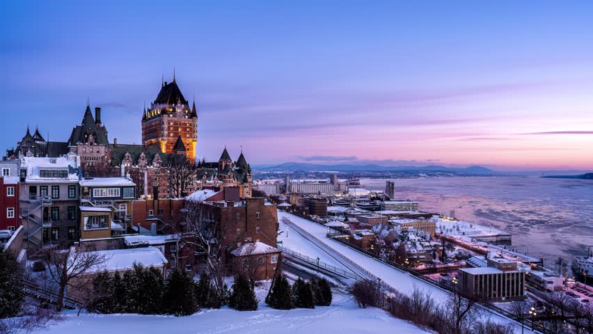 Night to day time lapse of pinky alpenglow over Fairmont Le Château Frontenac in winter morning at Quebec City Royalty-Free Stock Footage #3458389713