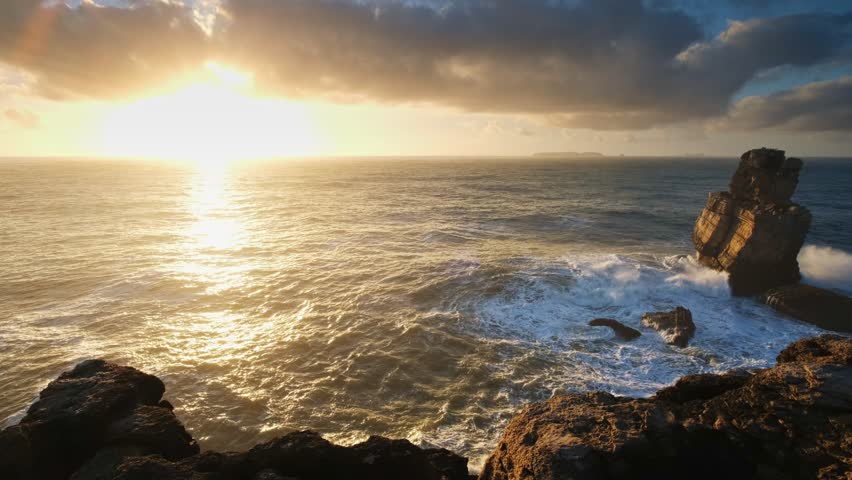Ocean cliff rock by the sea at sunset in Cabo Carvoeiro, Peniche, Portugal