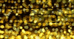 Video of Christmas decoration made of glowing garland. New Year illumination. Bright yellow and golden glitter lights background. Defocused shimmering light 4K resolution video
