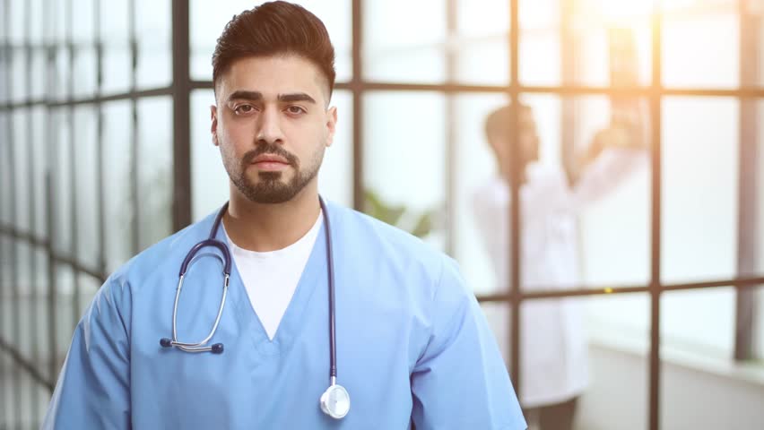 doctor posing at camera with arms crossed, healthcare and medicine. Royalty-Free Stock Footage #3458485611