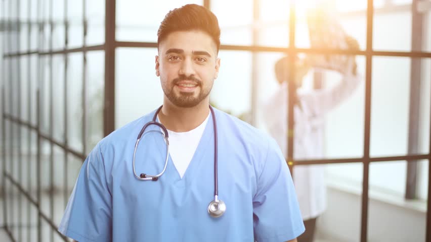 doctor posing at camera with arms crossed, healthcare and medicine. Royalty-Free Stock Footage #3458485793