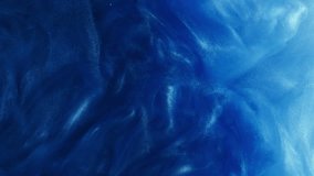 Glitter smoke texture. Ink water. Blue color glowing sparkles floating paint fluid mist motion decorative abstract art background. - Powered by Shutterstock - Get 15% off with code: PIKWIZARD15