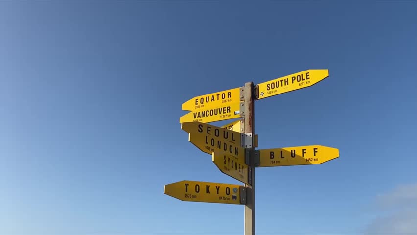 The All Around The World yellow Sign Posts showing different key travelling directions of some of the famous countries or cities in one single post, dream big for your future Royalty-Free Stock Footage #3458540665