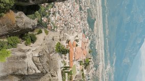 Vertical video. Meteora, Kalabaka, Greece. Monastery of St. Stephan. Meteora - rocks, up to 600 meters high. There are 6 active Greek Orthodox monasteries listed on the UNESCO list, Aerial View, Poin