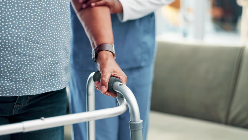 Patient, nurse and walking frame for support helping or rehabilitation for injury, person with a disability or comfort. People, healthcare worker and mobility aid in clinic for recovery, care or pain