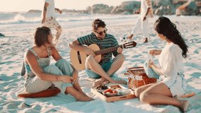Friends, picnic on beach and guitar for music with fun outdoor, reunion and people with celebration. Summer, holiday with social gathering or hangout, friendship and party with instrument and singing - Powered by Shutterstock - Get 15% off with code: PIKWIZARD15