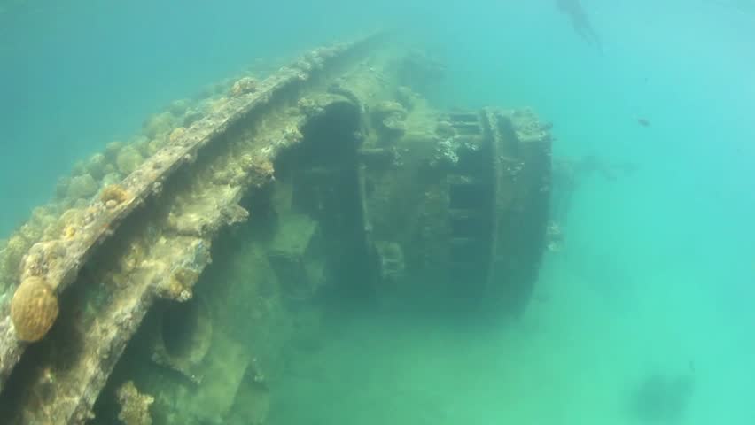 A shipwreck lies on the shallow, sandy bottom of Palau's inner lagoon.  This
