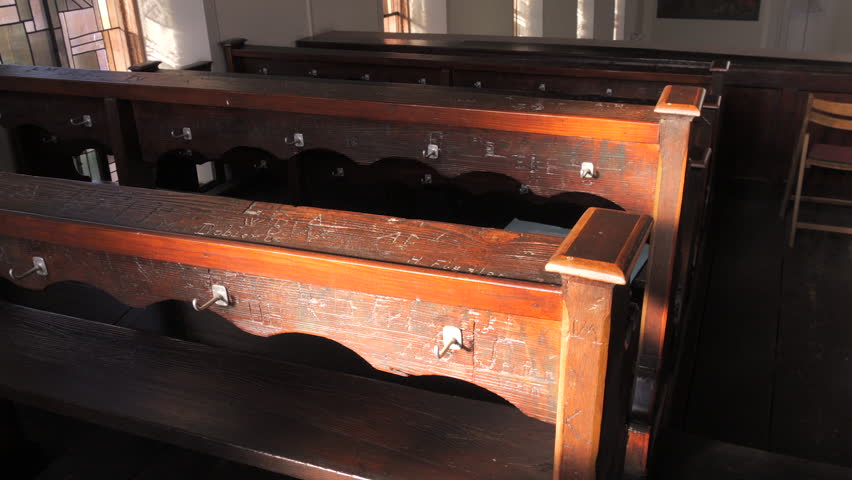 Scratched inscriptions on wooden church benches in the church
