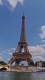 Vertical video: The Eiffel tower timelapse from waterfront at the river Seine sunny summer day in Paris. France