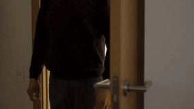 A dark room,a door opens with a silhouette of an unrecognisable man appears, he stands in the doorway and he watches his victim. Focus on the shadow. - Powered by Shutterstock - Get 15% off with code: PIKWIZARD15