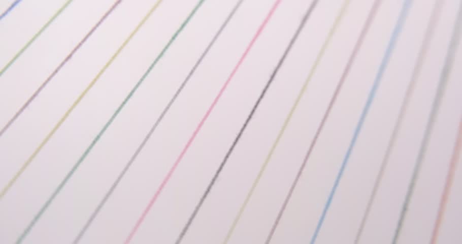Converging Multi-colored Sewing Thread on a rotating table, on white background