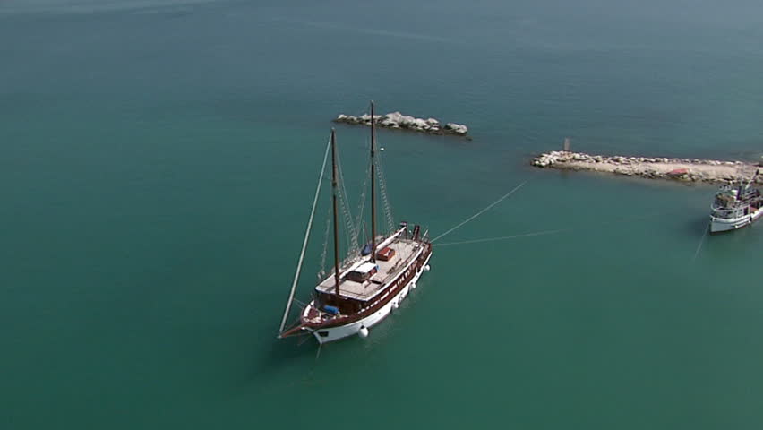 A wooden tourist sailboat anchored in the Adriatic sea